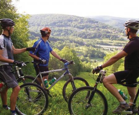 Riders overlooking Holiday Valley from the mountain bike trails