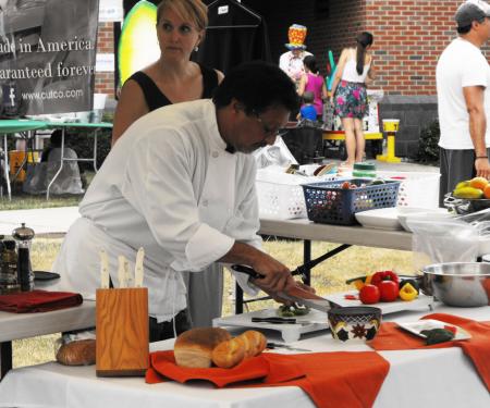 Chef preparing a meal at Taste of Olean / Art in the Park