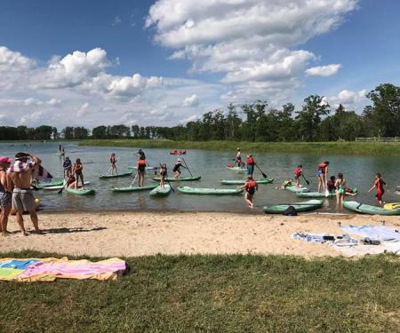 A photo from a past PaddleFest at Spruce Lake