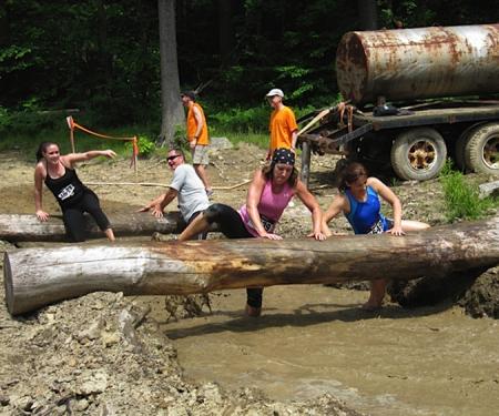 Log obstacle with mudpit during the Mudslide at Holiday Valley
