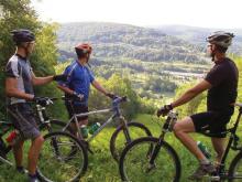 Riders overlooking Holiday Valley from the mountain bike trails