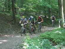 Mountain Bikers racing as part of the Raccoon Rally Cycling Festival at Allegany State Park